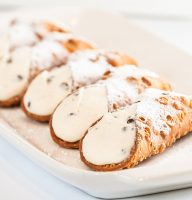 tray of classic ricotta cheese cannoli from italian bakery termini brothers
